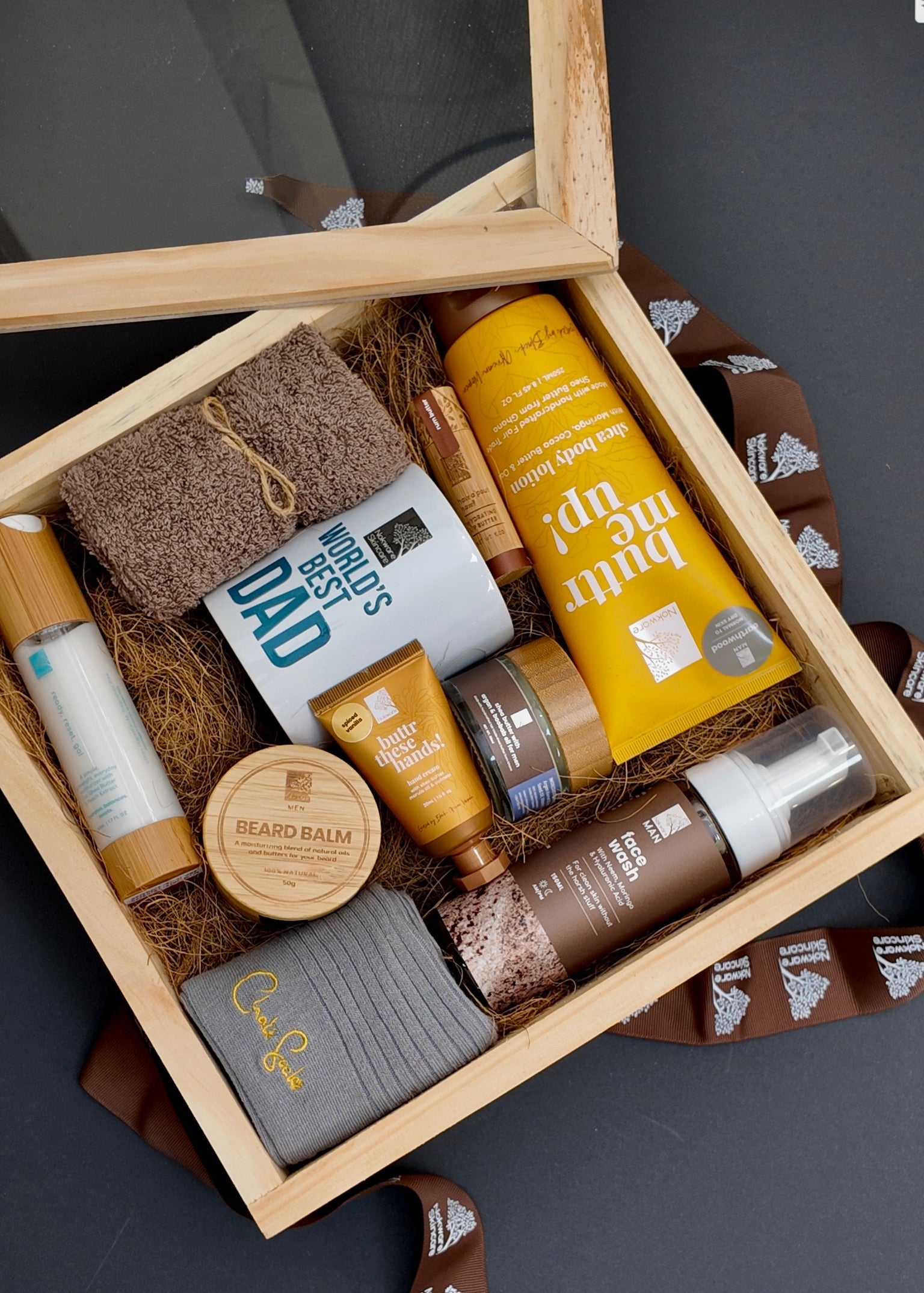 Nokware skincare Father's day box with various products in a wooden box on a dark background