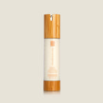 Morning Brightness brightening facial moisturizer in a frosted pump bottle with a bamboo cap and base, on a plain background